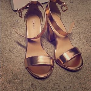 High heel shoes , rose gold